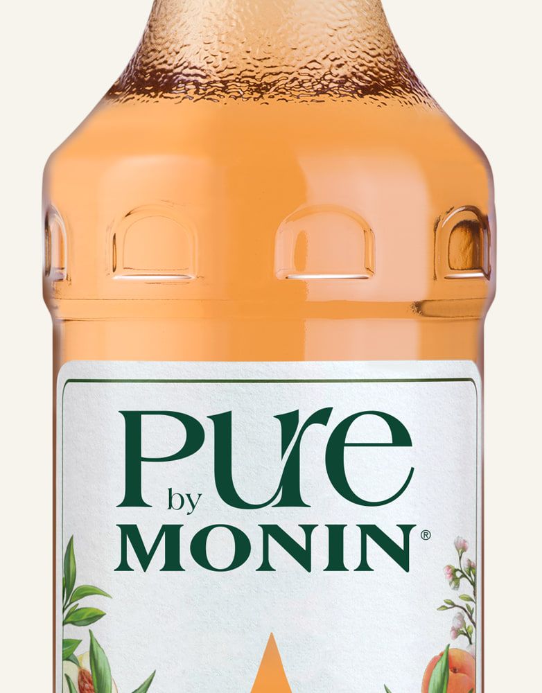 MONIN pure koncentrát Broskev & Meruňka 0,7l — láhev koncentrátu bez cukru