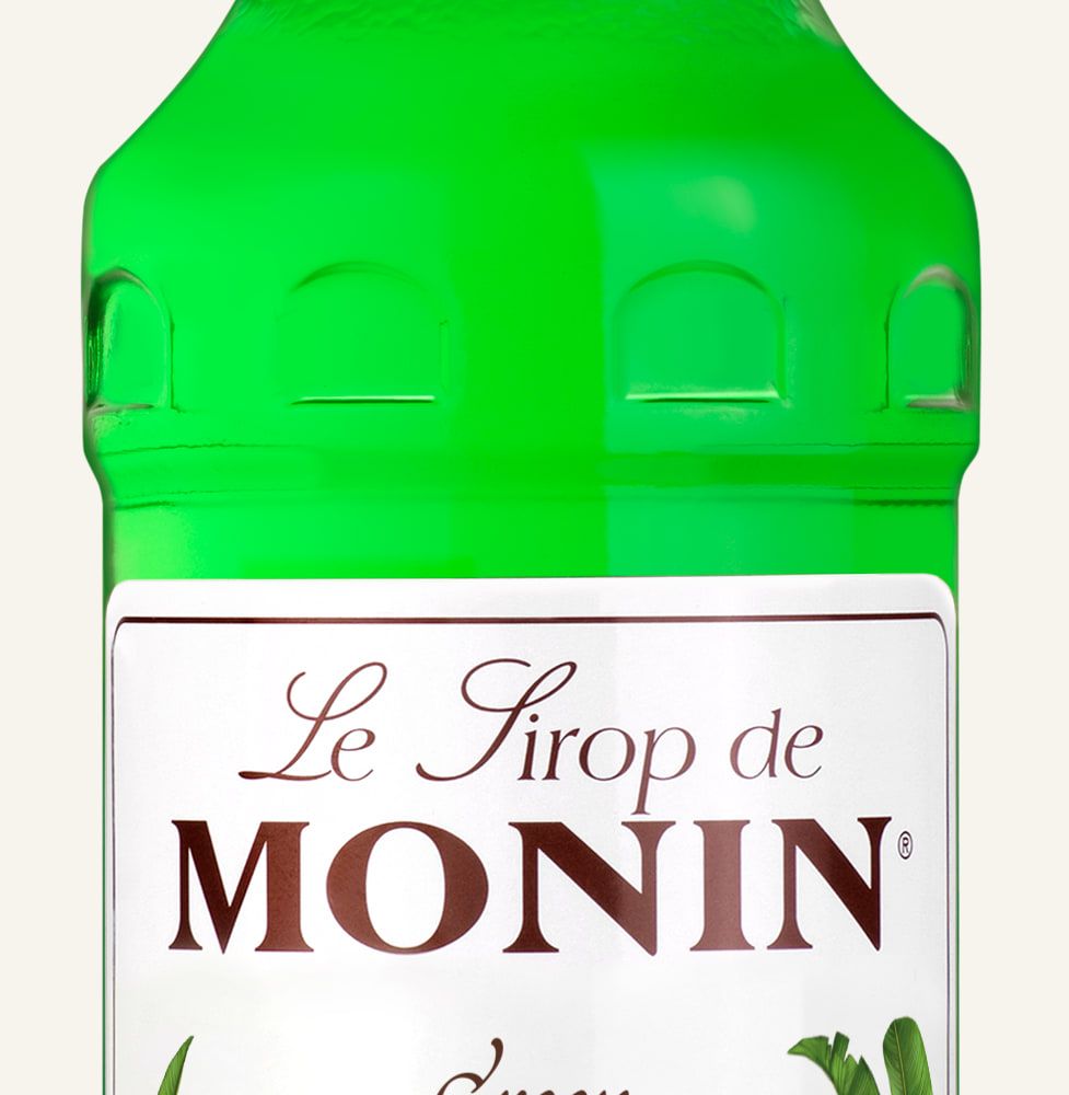MONIN sirup Banán zelený 0,7l — láhev barového sirupu