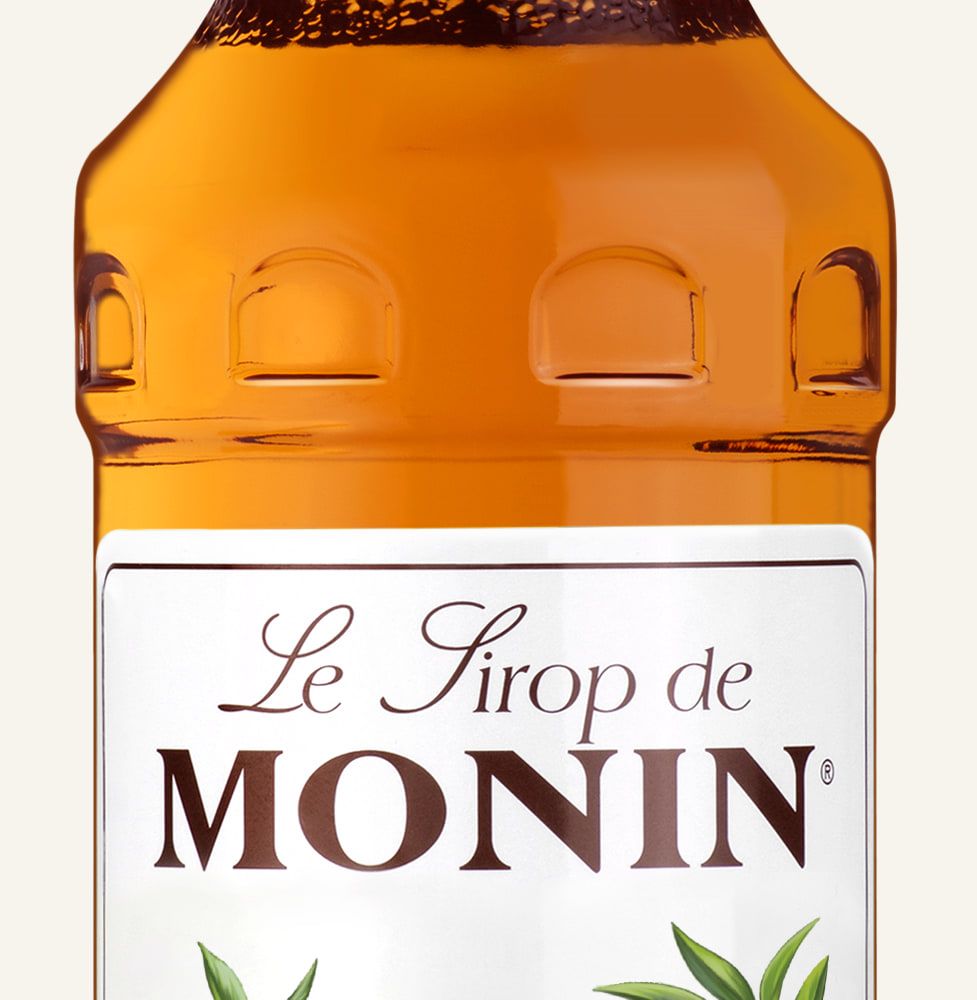 MONIN sirup Broskev 0,7l — láhev barového sirupu